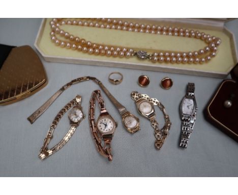 A 9ct yellow gold lady's wristwatch on an expanding bracelet strap, together with two other 9ct yellow gold lady's wristwatch