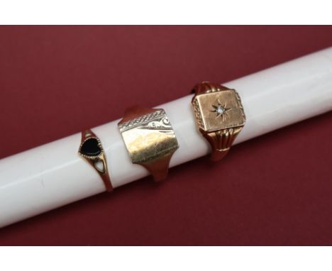 A 9ct gold signet ring set with a central diamond to a rectangular panel, size T 1/2 together with a 9ct gold onyx heart shap