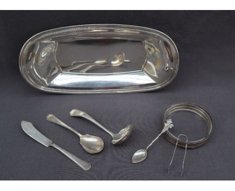 A Gorham sterling silver bowl of oval form with a beaded rim, 32cm wide together with Wallace Sterling ladle, spoon, sugar ni