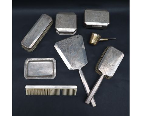 A Chinese white metal dressing table set, comprising a hand mirror, hair brush, clothes brush, comb, two boxes and covers and