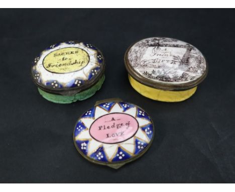 A Bilston enamel patch box, the oval lid decorated with a frame, basket ad flowers "A Friends Gift" together another Bilston 