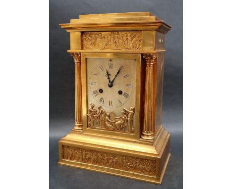 A gilt metal mantle clock of architectural form, with a stepped rectangular cornice with a frieze decorated with a chariot an