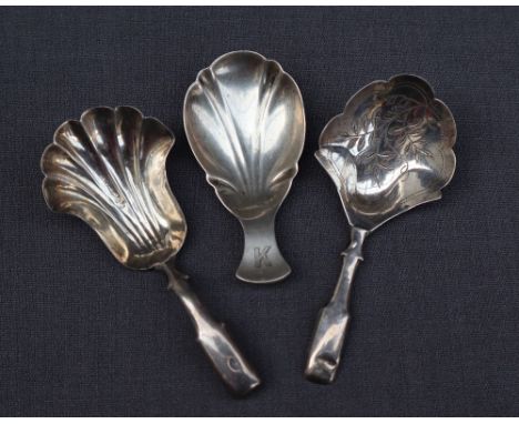 A Victorian silver fiddle pattern caddy spoon, with a shell shaped bowl, Birmingham, Hilliard &amp; Thomason together with a 