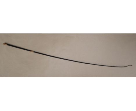 A Victorian 18ct gold mounted and leather whip, the pommel embossed with fruiting vines, with a similar band, Birmingham, 185