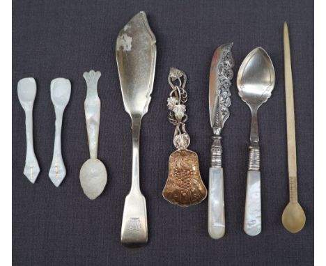 A William IV silver fish knife, London, 1835, together with a silver gilt caddy spoon embossed with grapes and leaves, a silv