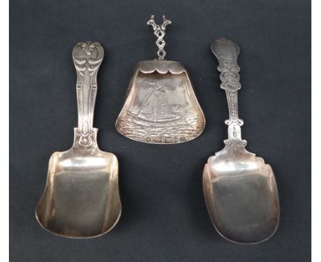 A Victorian silver caddy spoon, with an oval shaped bowl, Birmingham, 1877, George Unite together with another Victorian silv