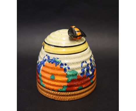 A Clarice Cliff Gayday pattern beehive preserve pot and cover, black printed mark CONDITION REPORT: Some surface scratches to