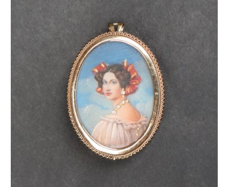 An 9ct gold portrait miniature pendant / brooch, depicting a lady wearing gem set jewellery, approximately 8 grams 