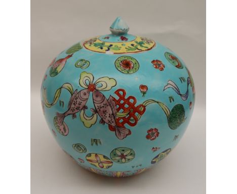 A Chinese porcelain vase and cover of squat form decorated with fish and swags to a turquoise ground, seal mark, 21cm high