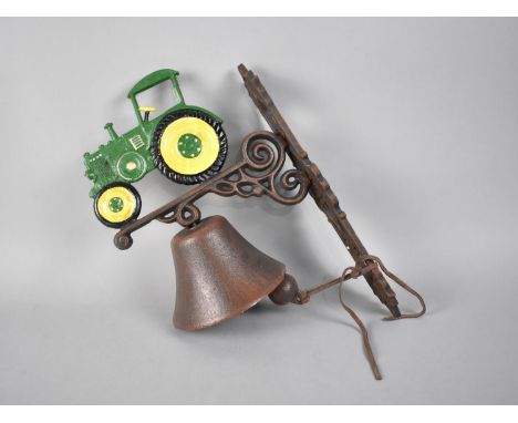 A Cold Painted Cast Metal Wall Mounting Bell with Tractor Motif 