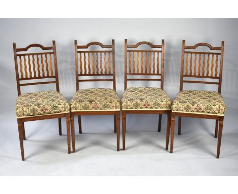 A Set of Four Edwardian Mahogany Framed Dining Chairs with tapestry Upholstery 