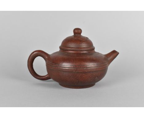 A Chinese Yixing Teapot with Floral Motif Lid, Seal Mark to Base, 17cm long 