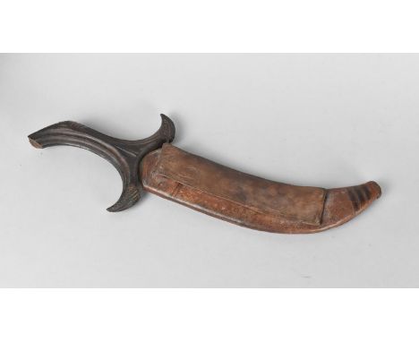 A Far Eastern Curved Bladed Kris Type Dagger with Leather Scabbard , 30cm Long 