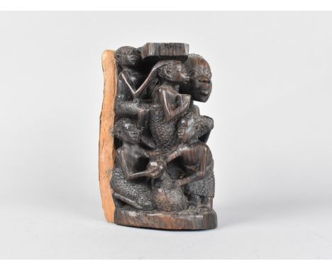 A Carved Section of African Tree Trunk Depicting Family, 17cm high 
