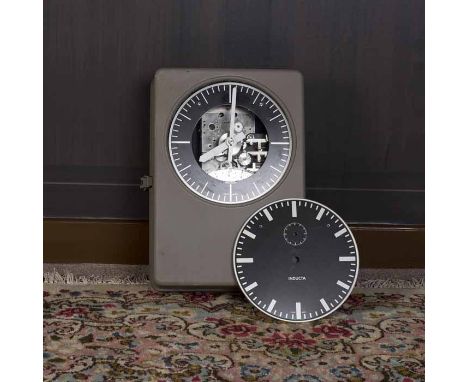 INDUCTA ELECTRIC WALL MOUNTED CLOCK 
circa 1950s, electronic movement, the signed black skeleton dial with baton hour markers