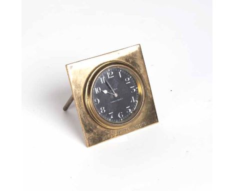 UNUSUAL EIGHT DAY BRASS TRAVEL CLOCK
keyless wind "Rands" movement, the black dial with stylised white Arabic numerals, steel