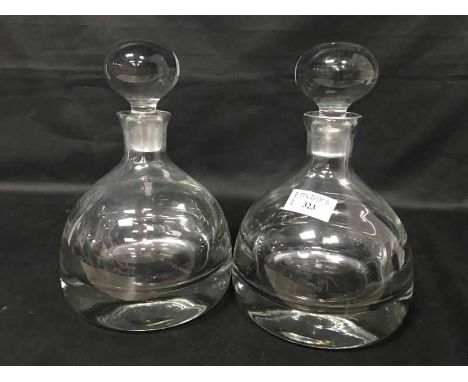 PAIR OF SHIP STYLE DECANTERSalong with a glass biscuit barrel and a Royal Doulton crystal decanter
