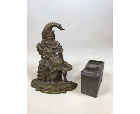 A brass Punch doorstop H:32cm also with a lead tea caddy A/F