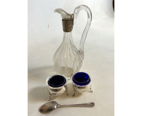 A Pair of silver salts with liners also with a silver spoon and a silver collared vinegar bottle. 