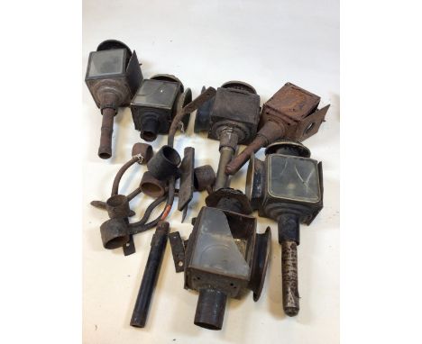 A quantity of vintage carriage lamps also with pots and brackets 