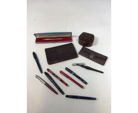 A quantity of pens including Onoto, The Pen, Swan, Parker,  Osmiroid also with small leather accessories 