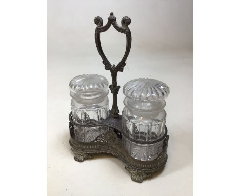 A vintage Castor set - two lidded glass jars in metal standW:20cm x H:26cm