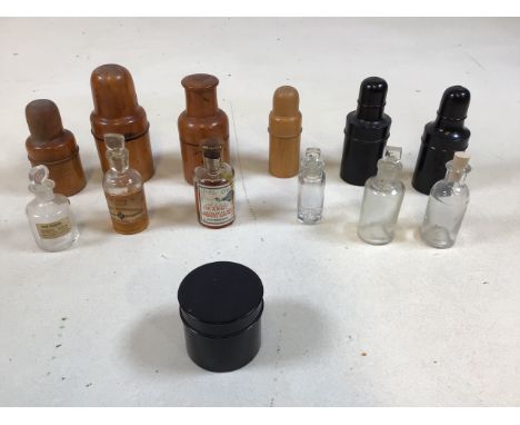 Treen and Bakelite pharmaceutical bottle holders. One inscribed with Savory &amp; Moore , Lancaster Terrace