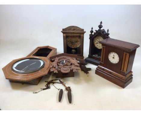 A Black Forest style wall clock with Three mantle clock and a wall clock in A/f condition for spares and repairs 