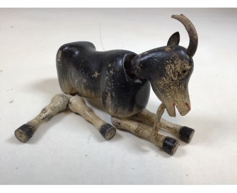 A painted wooden vintage articulated goat. a/FW:19cm x H:18cm