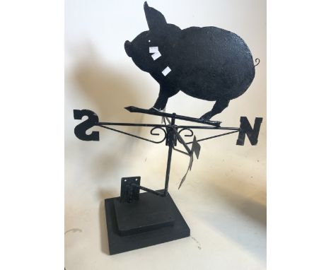 A pig weather vane on wooden plinth. H:77cm