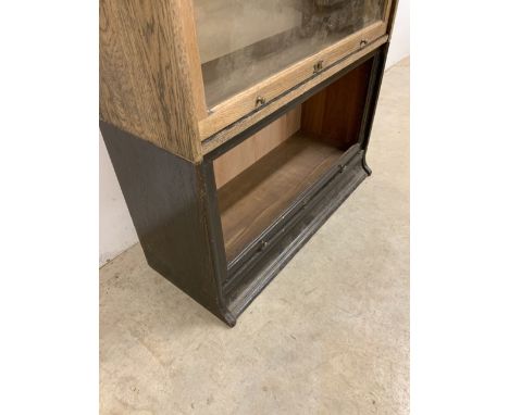 An early 20th century Lebus five section oak library bookcase. Glass missing to lowest section. Recently replaced panel backs
