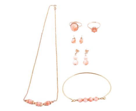 Two coral rings, coral necklace, coral bangle and two pairs of coral earrings, a carved coral ring, the oval floral design ca