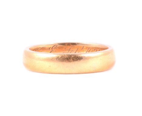A 22 carat gold wedding band, 4.65mm wide plain polished D shape ring size O½, inside shank inscribed A Token of Love J-E Sep