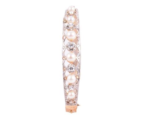 A Victorian style half hinged bangle with cultured pearls and synthetic white stones, the six cultured pearls peg set and div