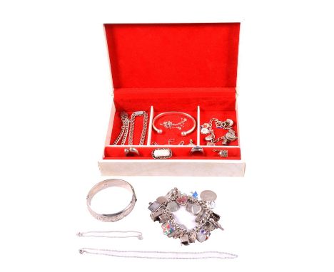 A jewel box with silver jewellery, a silver solid curb link bracelet with charms attached and padlock fastener; another small