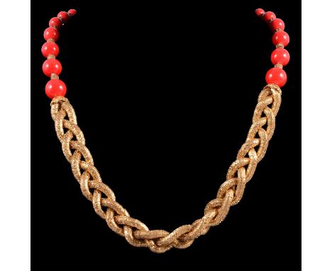 A vintage red bead and plaited necklace, probably French, the red beads graduating from 5.5-13mm, joined by gilt metal bell s