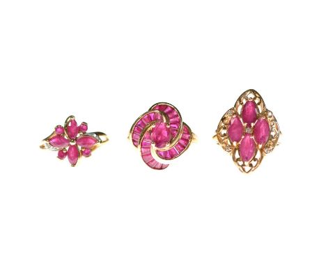 Three ruby rings, a ruby and diamond ring, the four marquise mixed cut rubies claw set and five brilliant cut diamonds claw s