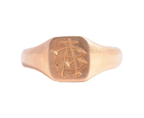 An 18 carat yellow gold signet ring size T, 9mm cushion shaped head engraved BA in monogram, London 1919, 11.5g.