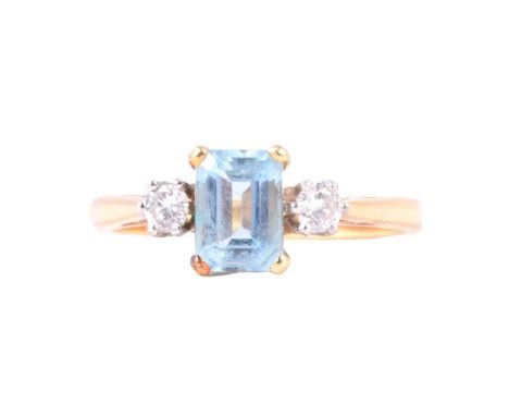 An aquamarine and diamond ring, the rectangular step cut stone, 7x4.5mm, four claw set with a brilliant cut diamond to each s