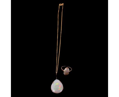 An opal dress ring and an opal pendant on a chain, an opal dress ring, the oval cabochon cut opal, approximately 13.5x10mm, c