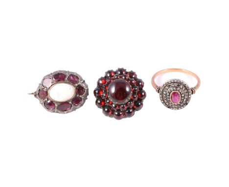 A ruby and diamond chip ring, opal and pink stone brooch and red stone target brooch, a ruby and diamond chip ring, the oval 