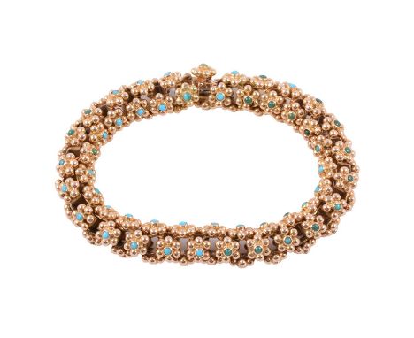 An 18 carat yellow gold bracelet, 12mm gauge tubular section formed from small floral links of six gold beads with central ca