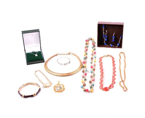A collection of vintage costume jewellery pendants, chains, bangles and bracelets, a metal open heart shape paste set pendant