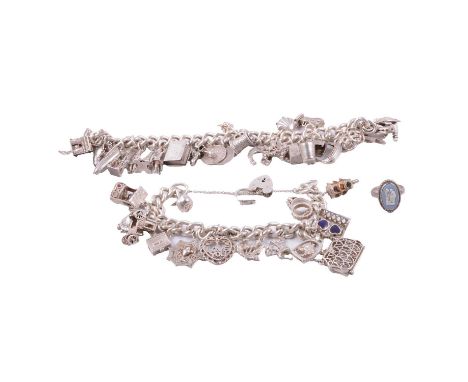 Two silver charm bracelets and a Wedgwood ring, a 9.5mm solid curb link chain with twenty-nine charms attached, no fastener; 