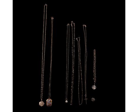 A collection of gold pendants and chains, lockets, cross, bracelet and charms, a 9 carat yellow and white gold floral design 