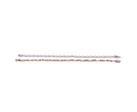 Two diamond bracelets, a diamond floral motif bracelet, the twenty-five floral motifs set with four brilliant cut diamonds cl