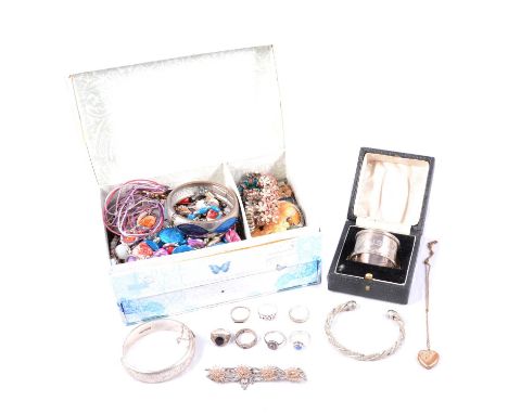 A collection of rolled gold, silver, white metal and costume jewellery, a rolled gold heart-shape photograph locket on a gilt