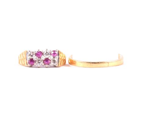 A ruby and diamond ring, broken shank, four brilliant cut diamonds and four rubies claw set in two horizontal rows in an 18 c