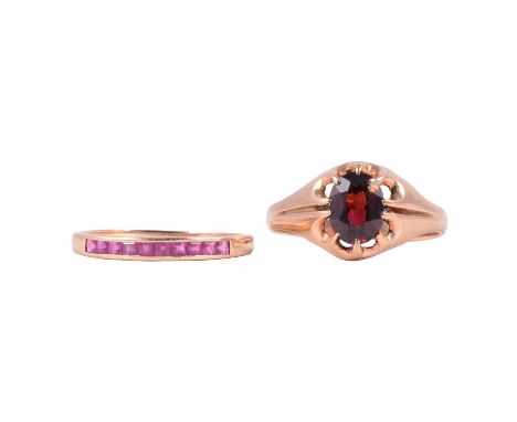 A ruby half eternity ring and a garnet solitaire ring, a ruby half eternity ring, the ten square cut stones channel set in a 