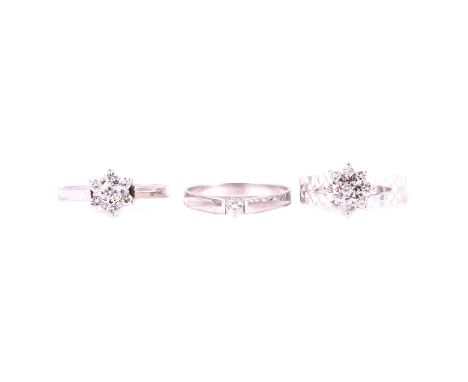 Three 9 carat white gold diamond rings, a diamond solitaire ring, the brilliant cut stone, approximately 3mm diameter, claw s